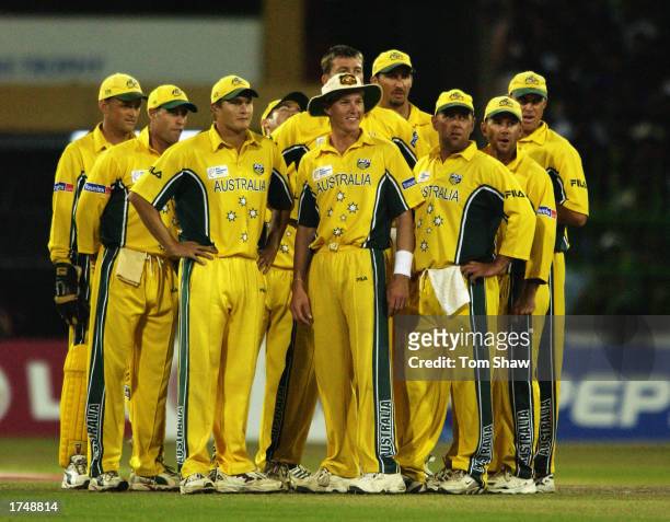 The Australian team wait for the third umpire's decision during the ICC Champions Trophy semi-final match between Sri Lanka and Australia held on...