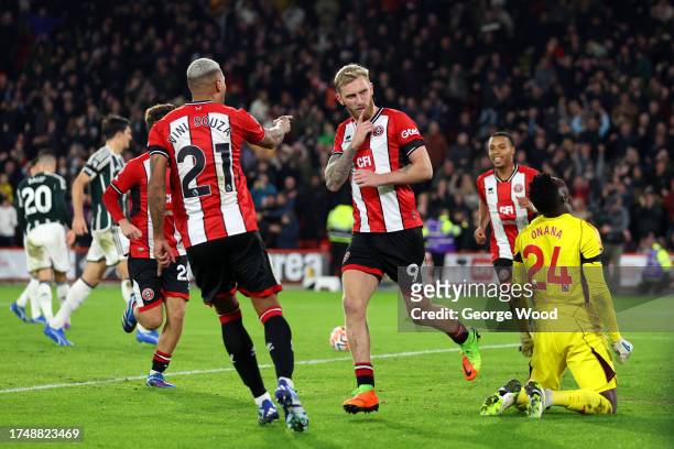 Oliver McBurnie of Sheffield United celebrates after scoring the team's first goal from the penalty spot during the Premier League match between...
