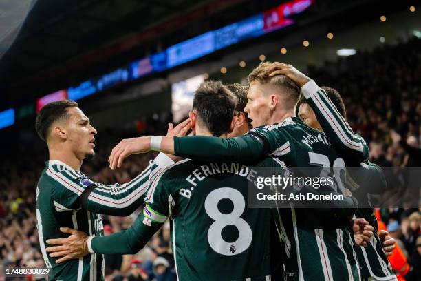 Scott McTominay of Manchester United celebrates with team mates after scoring their sides first goal during the Premier League match between...