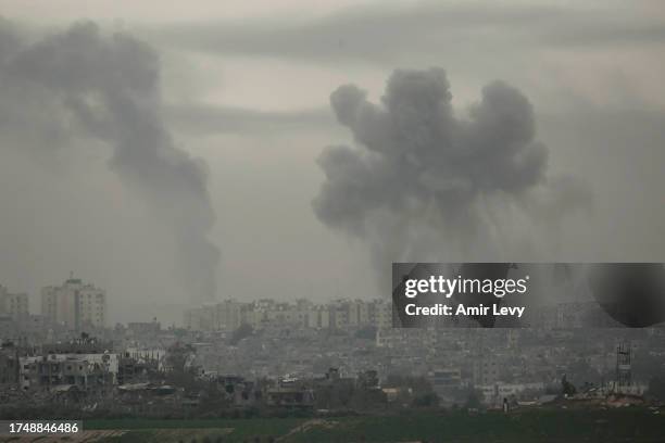 Smoke is seen over Beit Hanoun in the Gaza Strip as result of the Israeli attack from the Israeli side of the border on October 27, 2023 in Sderot,...