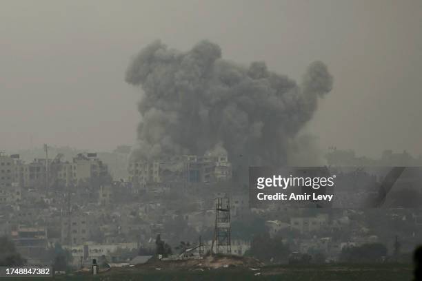 Smoke is seen over Beit Hanoun in the Gaza Strip as result of the Israeli attack from the Israeli side of the border on October 27, 2023 in Sderot,...