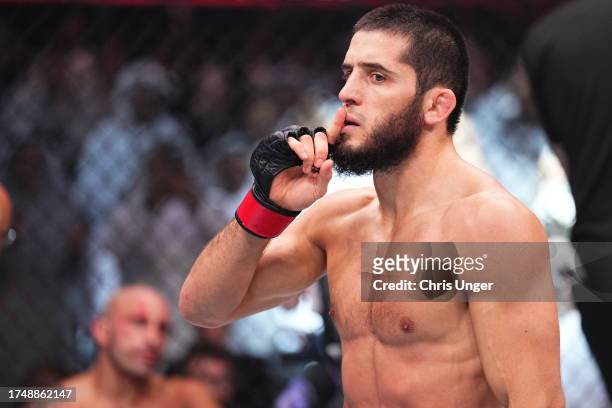 Islam Makhachev of Russia reacts after his knockout victory against Alexander Volkanovski of Australia in the UFC lightweight championship fight...