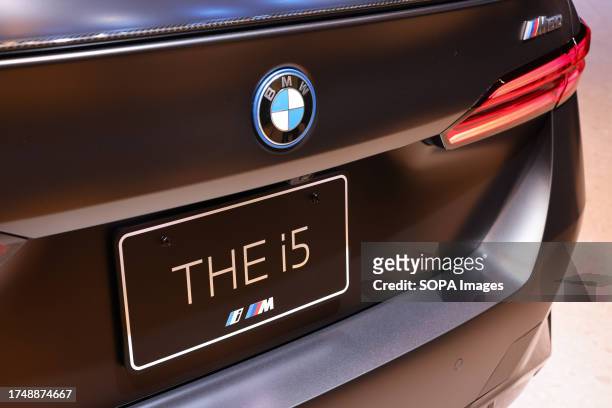 Logo on the hatch of BMW i5 exhibition vehicle at the Japan Mobility Show 2023 in Tokyo Big Sight. The Japan Mobility Show 2023 is the biggest car...