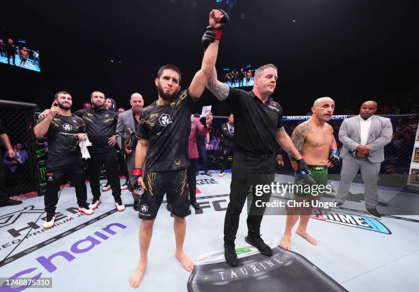 Islam Makhachev of Russia reacts after his knockout victory against Alexander Volkanovski of Australia in the UFC lightweight championship fight...