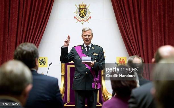 In this handout provided by the Chancellerie du Premier Ministre, King Philippe of Belgium takes his oath during his Inauguration following the...