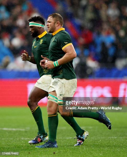 Siya Kolisi and Duane Vermeulen of South Africa leave the field after being substituted during the Rugby World Cup France 2023 match between England...