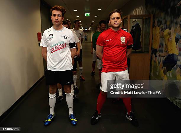 Nick Grimshaw and Olly Murs and teams line up before the start of the BBC Radio 1 five-a-side football match between Team Grimshaw, captained by BBC...