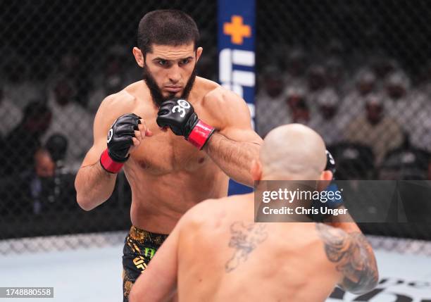 Islam Makhachev of Russia battles Alexander Volkanovski of Australia in the UFC lightweight championship fight during the UFC 294 event at Etihad...