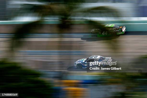 John Hunter Nemechek, driver of the Pye Barker Fire & Safety Toyota, and Jeffrey Earnhardt, driver of the ForeverLawn Chevrolet, race during the...