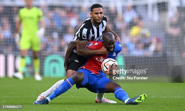 Jamaal Lascelles of Newcastle challenges Crystal Palace striker Jean-Philippe Mateta during the Premier League match between Newcastle United and...