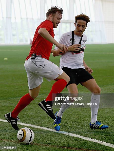 Olly Murs and Nick Grimshaw compete for the ball during the BBC Radio 1 five-a-side football match between Team Grimshaw, captained by BBC Radio 1 DJ...