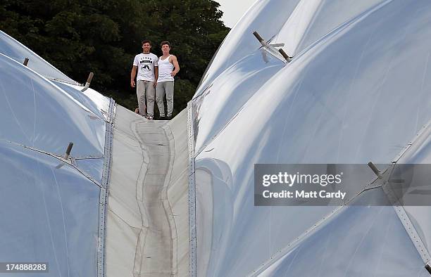 Pip Andersen and Tim Shieff, both professional freerunner and parkour experts, stand on the roof of the Eden's Rainforest Biome on July 29, 2013 in...