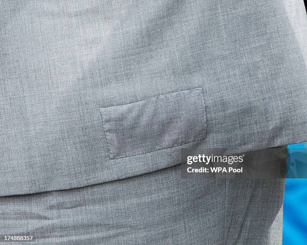 Prince Charles, Prince of Wales' lable is seen in his suit during a visit to The Whitstable Oyster Festival on July 29, 2013 at Whitstable Harbour,...