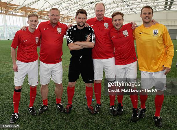 Team Murs captain Olly Murs lines up with David May and team-mates before the start of the BBC Radio 1 five-a-side football match between Team...