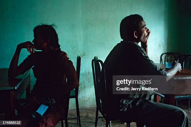 Two people take their morning tea and pastries at a teashop in Kilinochchi, the administrative town for the Tamil Tigers in Sri Lanka. Northern Sri...