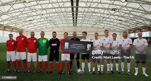 Team Grimshaw captain Nick Grimshaw , Robbie Savage and team-mates line up with Team Murs captain Olly Murs , David May and team-mates before the...