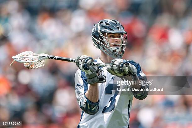Matt Abbott of the Chesapeake Bayhawks looks to pass against the Denver Outlaws during a Major League Lacrosse game at Sports Authority Field at Mile...