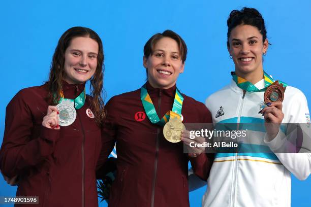 Silver medalist Sophie Angus of Canada, gold medalist Rachel Nicol of Canada and bronze medalist Macarena Ceballos of Argentina pose in the podium of...