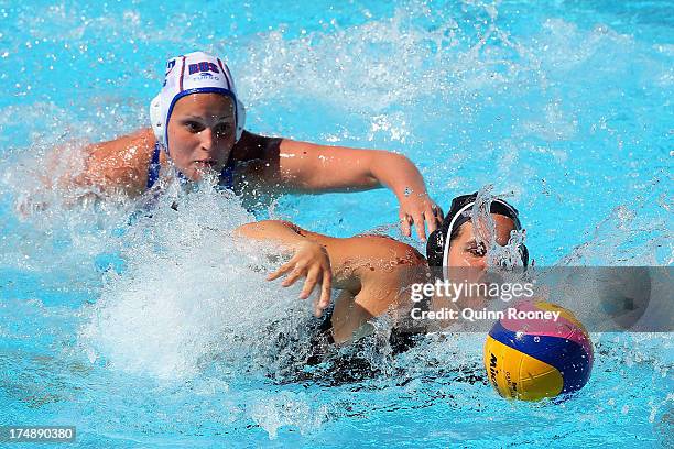 Katrina Monton of Canada and Ekaterina Zelentsova of Russia comete for the ball during the Women's Water Polo quarterfinal match between Russia and...