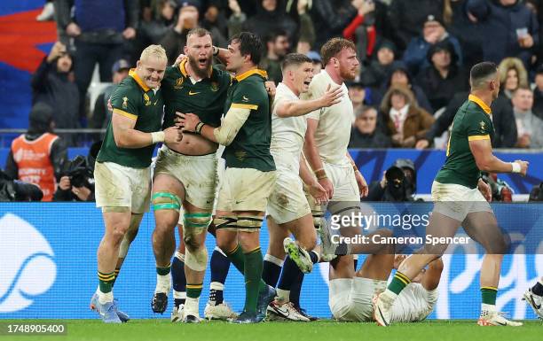 Snyman of South Africa celebrates with teammates after scoring his team's first try during the Rugby World Cup France 2023 match between England and...