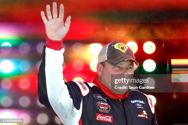 Ryan Newman, driver of the Generx Generators Ford, waves to fans as he walks onstage during driver intros prior to the NASCAR Xfinity Series...