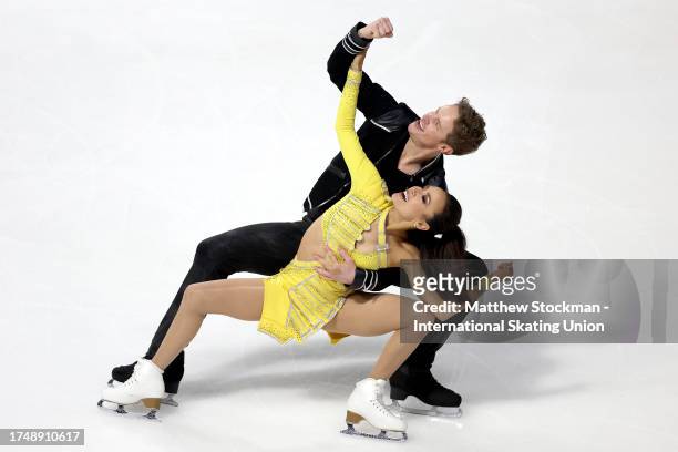 Madison Chock and Evan Bates of United States skate in the Ice Dance Rhythm Dance during the ISU Grand Prix of Figure Skating - Skate America at...