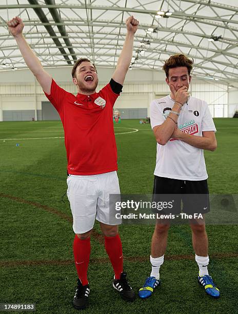 Olly Murs, Captain of Team Murs celebrates his team's win,as Nick Grimshaw, Captain of Team Grimshaw looks on after the BBC Radio 1 five-a-side...