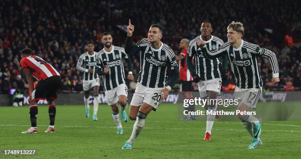 Diogo Dalot of Manchester United celebrates scoring their second goal during the Premier League match between Sheffield United and Manchester United...