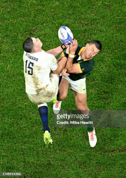 Freddie Steward of England and Handre Pollard of South Africa compete to catch the high ball during the Rugby World Cup France 2023 match between...