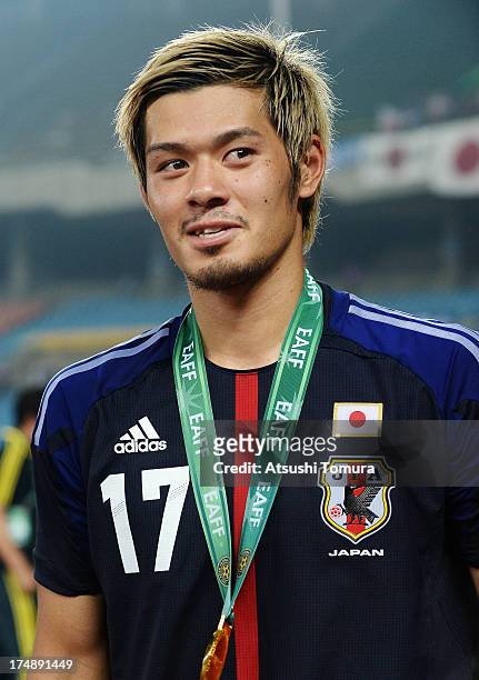 Hotaru Yamaguchi of Japan looks on after winning the EAFF East Asian Cup 2013 at Jamsil Stadium on July 28, 2013 in Seoul, South Korea.