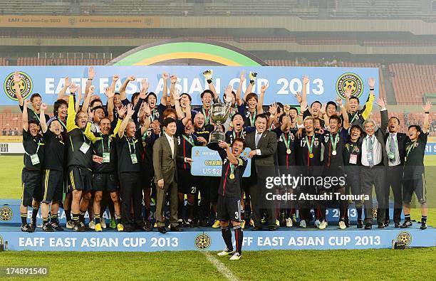 Captain Yuichi Komano and players of Japan celebrate with the trophy after winning the EAFF East Asian Cup 2013 at Jamsil Stadium on July 28, 2013 in...