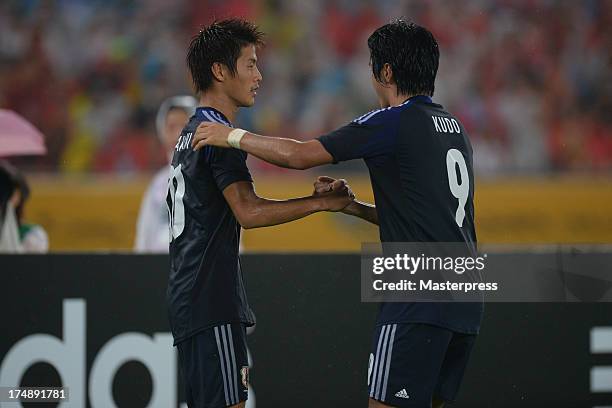 Yoichiro Kakitani of Japan celebrates scoring his team's first goal with his team mate Masato Kudo during the EAFF East Asian Cup match between Korea...