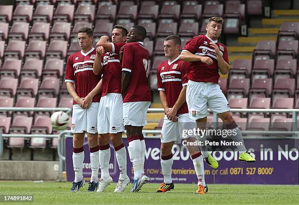 Ben Tozer, Darren Carter, JJ Hooper, Lee Collins and Gary Deegan of Northampton Town line up to defend a free kick during the Pre-Season Friendly...