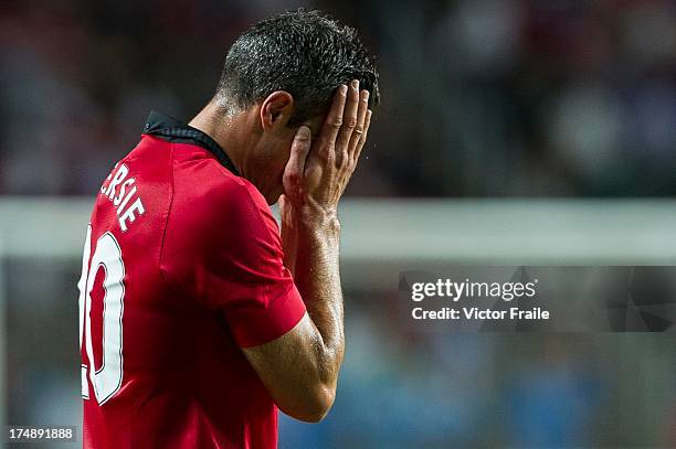 Robin Van Persie of Manchester United wipes his face during the international friendly match between Kitchee FC and Manchester United at Hong Kong...