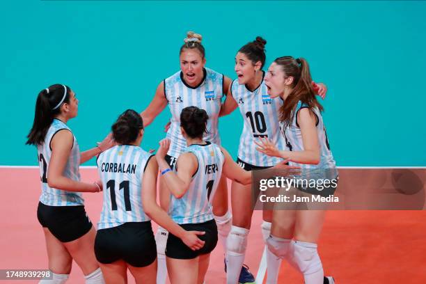 Players of Argentina celebrate after winning a match against Puerto Rico during the Women's Volleyball first round as part of the Santiago 2023 Pan...