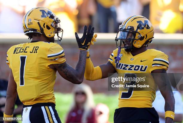 Wide receiver Theo Wease Jr. #1 and wide receiver Luther Burden III of the Missouri Tigers celebrate after a touchdown during the 1st half of the...