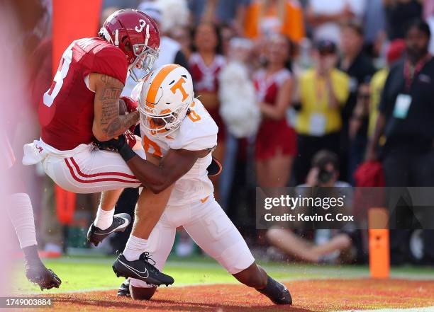 Jermaine Burton of the Alabama Crimson Tide pulls in this touchdown reception against Doneiko Slaughter of the Tennessee Volunteers during the second...