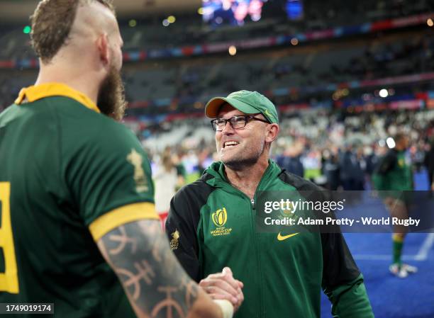 Snyman of South Africa shakes hands with Jacques Nienaber, Head Coach of South Africa, following the team's victory during the Rugby World Cup France...