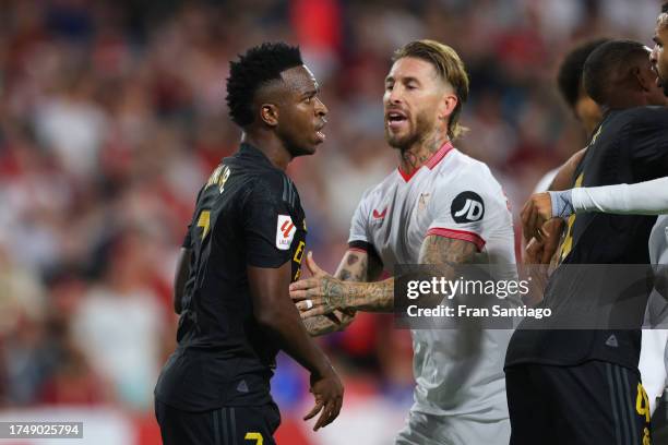 Vinicius Junior of Real Madrid and Sergio Ramos of Sevilla FC clash during the LaLiga EA Sports match between Sevilla FC and Real Madrid CF at...