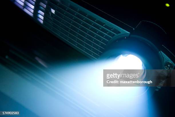 digital projector with bright beam - multimedia presentation stock pictures, royalty-free photos & images