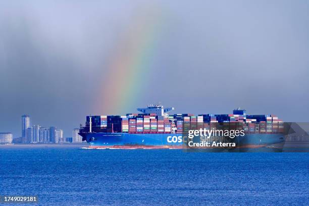 Chinese container ship / containership COSCO Shipping Sagittarius loaded with containers on the North Sea, sailing under flag of Hong Kong, China.
