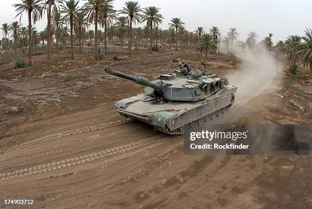 fisheye style image of a tank driving on a dirt road - storage container stock pictures, royalty-free photos & images