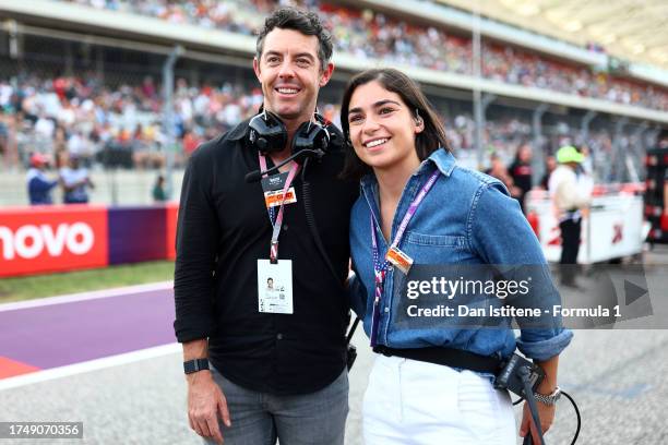 Rory McIlroy and Jamie Chadwick pose for a photo on the grid during the Sprint ahead of the F1 Grand Prix of United States at Circuit of The Americas...