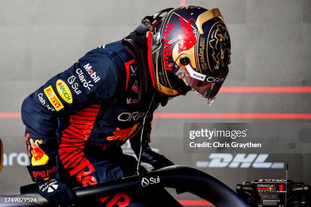 Sprint winner Max Verstappen of the Netherlands and Oracle Red Bull Racing climbs out of his car in parc ferme during the Sprint ahead of the F1...