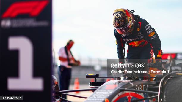 Sprint winner Max Verstappen of the Netherlands and Oracle Red Bull Racing climbs out of his car in parc ferme after the Sprint ahead of the F1 Grand...