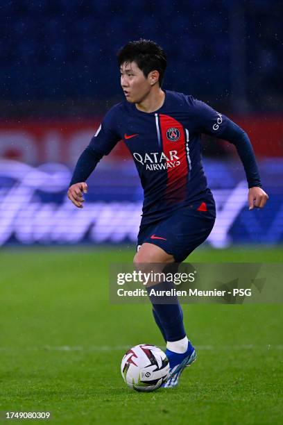 Lee Kang-In of Paris Saint-Germain runs with the ball during the Ligue 1 Uber Eats match between Paris Saint-Germain and RC Strasbourg at Parc des...