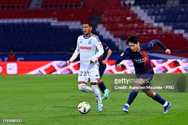 Lee Kang-In of Paris Saint-Germain runs with the ball during the Ligue 1 Uber Eats match between Paris Saint-Germain and RC Strasbourg at Parc des...
