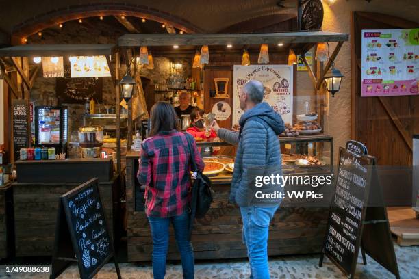 Bar cafe in the romanesque medieval fortified town of Besalu in La Garrotxa Girona Catalonia, Spain.