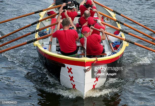 rowing a boat together - rowing team stock pictures, royalty-free photos & images