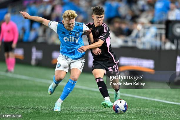 Noah Allen of Inter Miami and Kamil Jóźwiak of Charlotte FC battle for the ball during the first half at Bank of America Stadium on October 21, 2023...